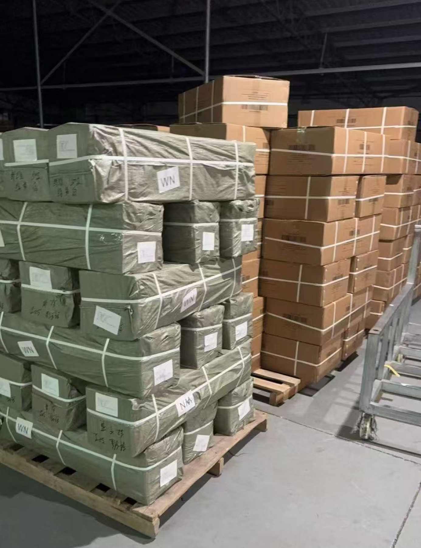 Fabric and carton stock staged on pallets in the warehouse