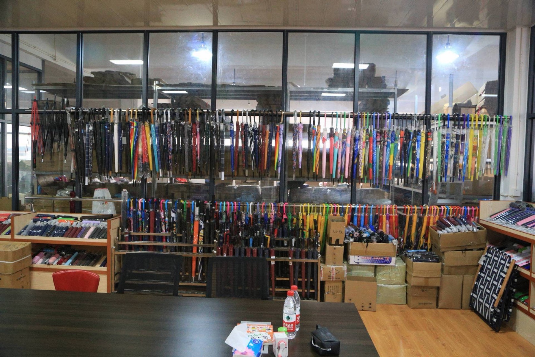 Sample room with hanging stick umbrellas and compact rows